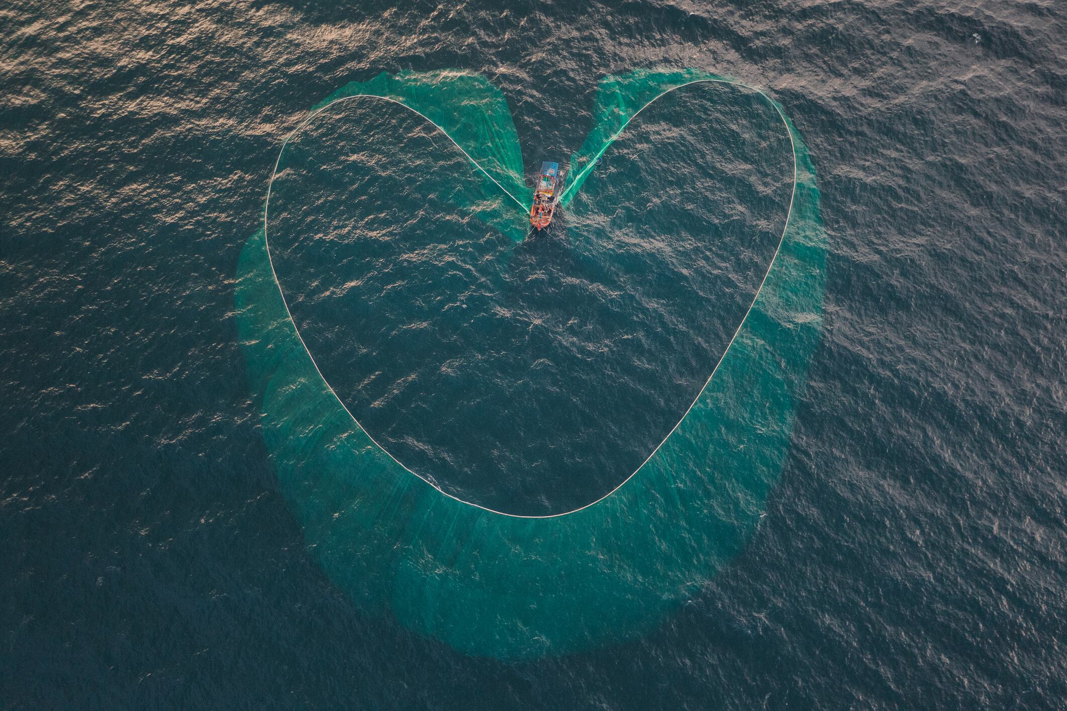 Aerial image showing a trawler net in the shape of a heart, Vietnam