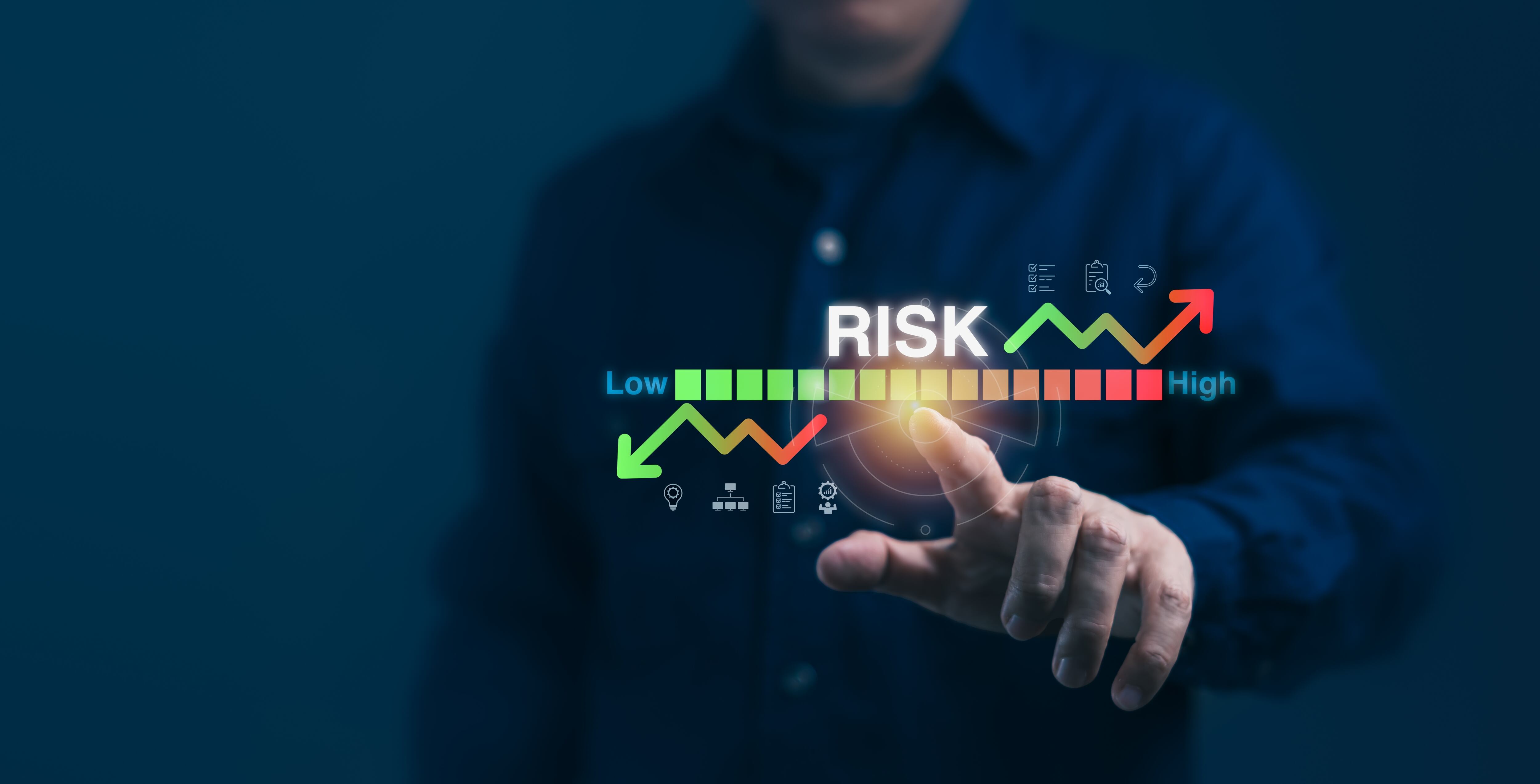 Man pointing at low-high risk chart