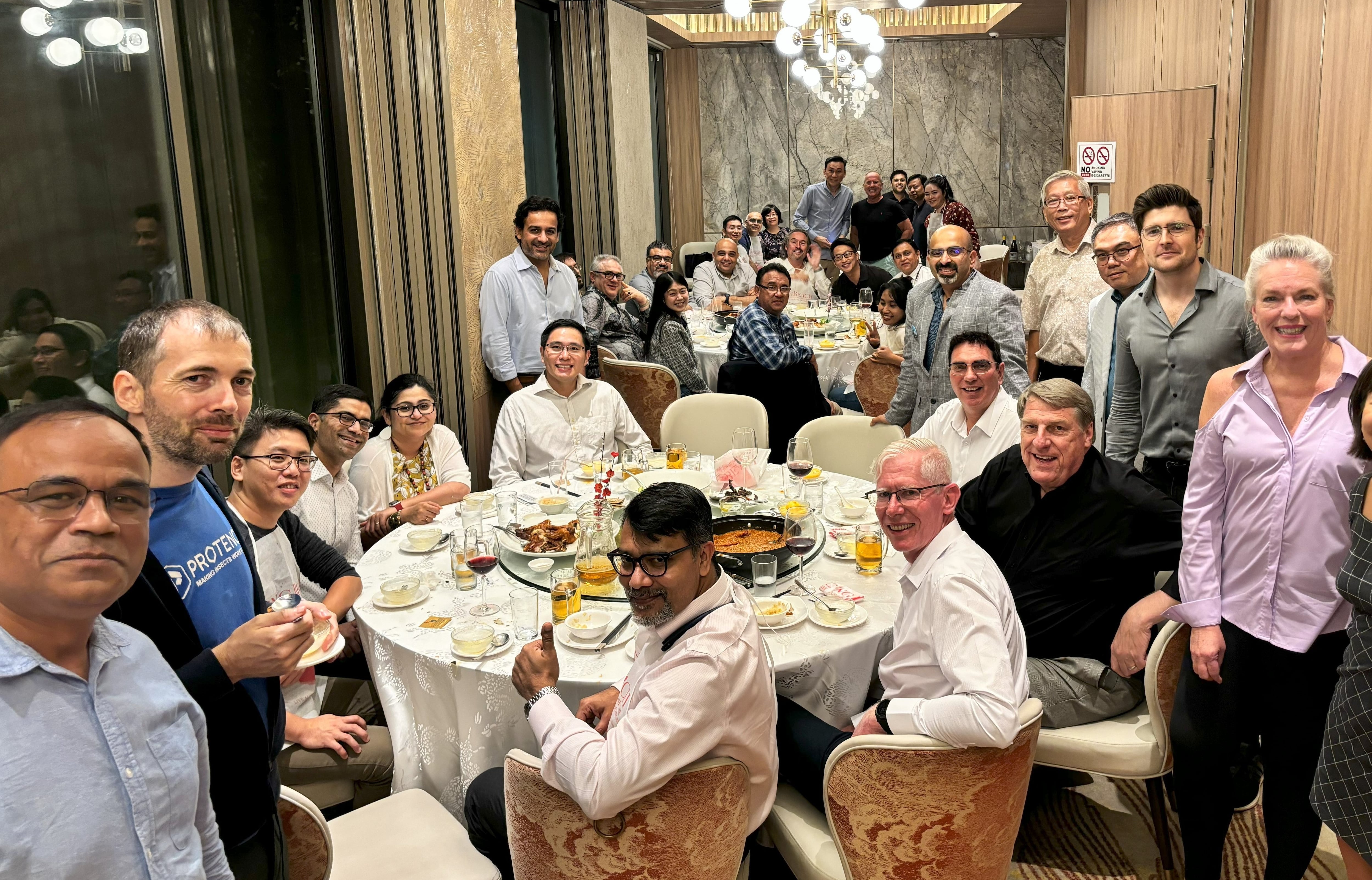 Some Yield Lab portfolio companies and investors at a dinner in Singapore